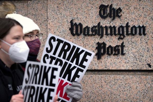 Employees of The Washington Post picket outside the company's offices on Thursday, Dec. 7.